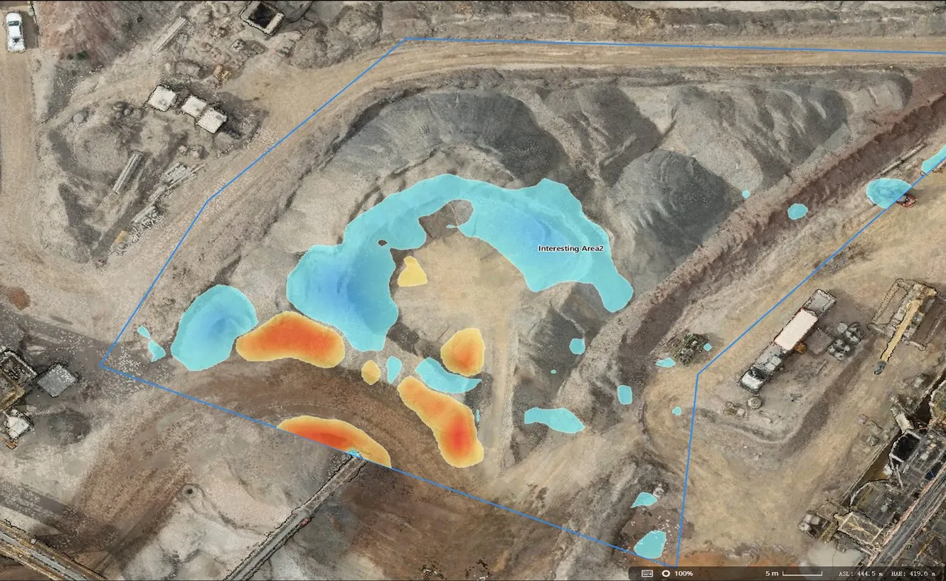 Stockpile model coloured blue and red where material was removed or added between two flights